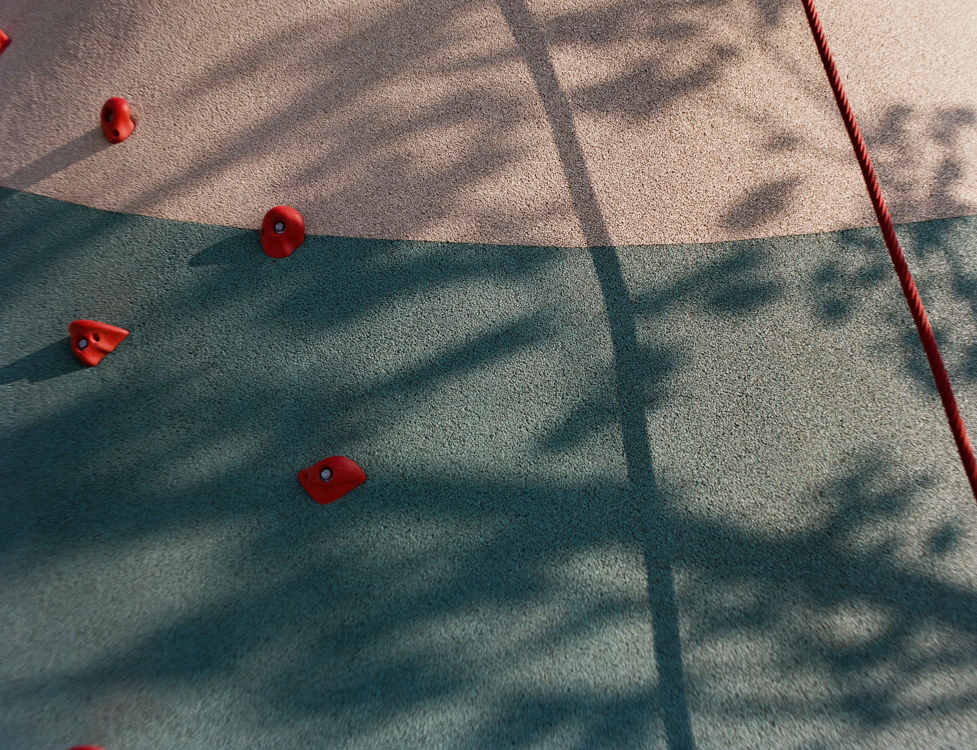 the shadows on the climbing wall captured on C41 color film