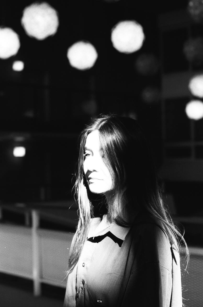 girl under nght lights on black and white film