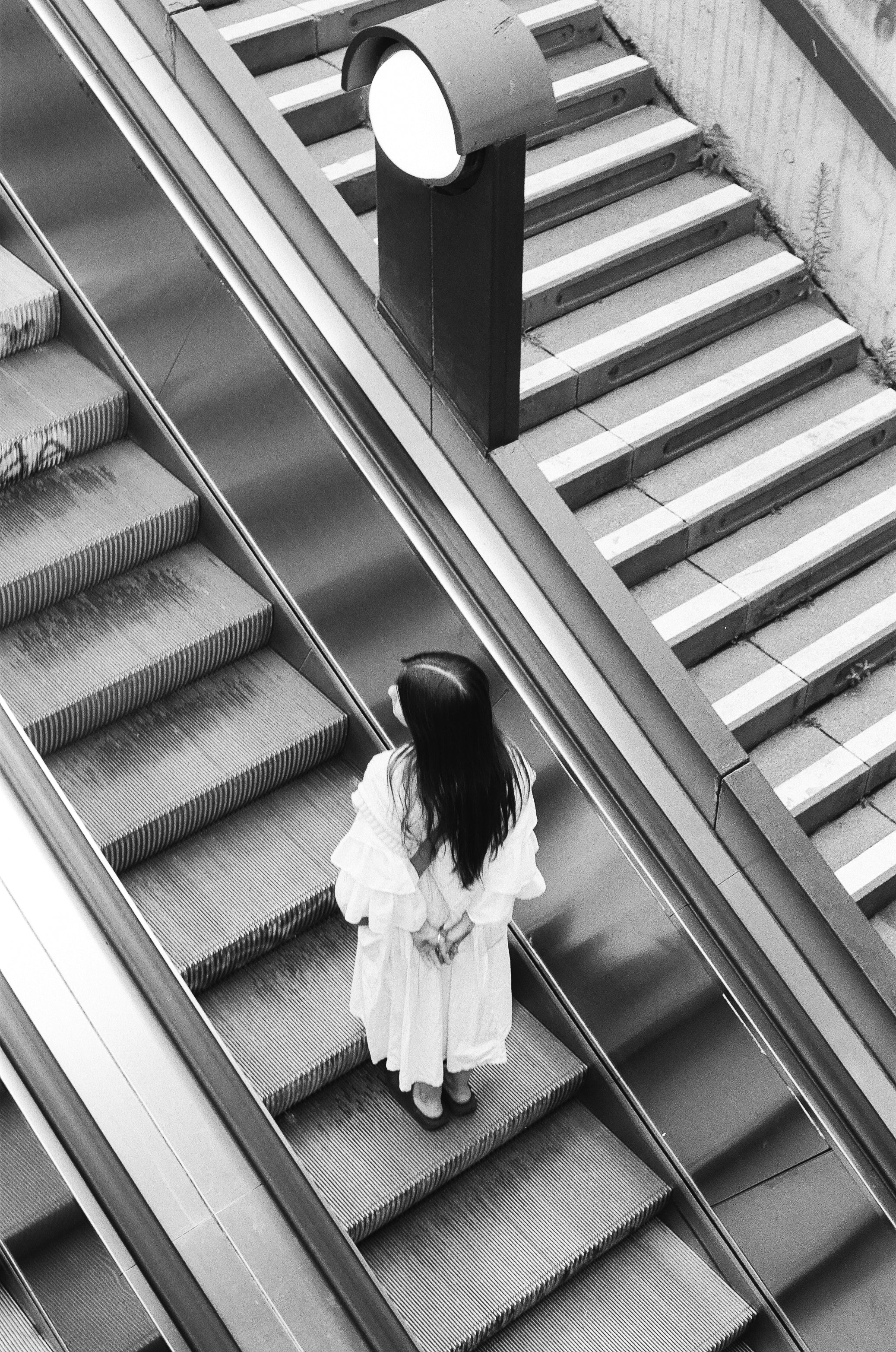 girl on elevator on black and white film