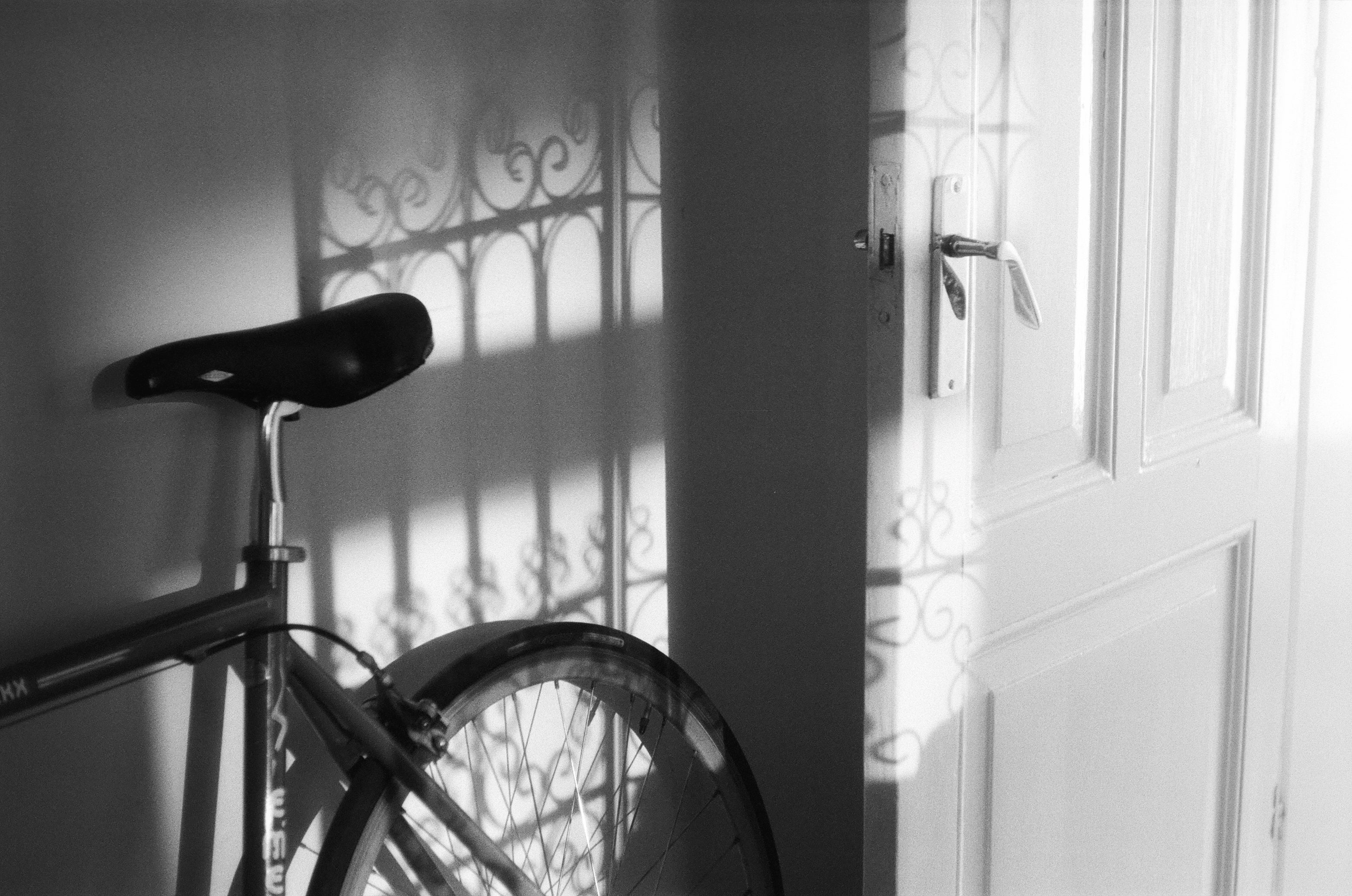 bike near wall on black and white film