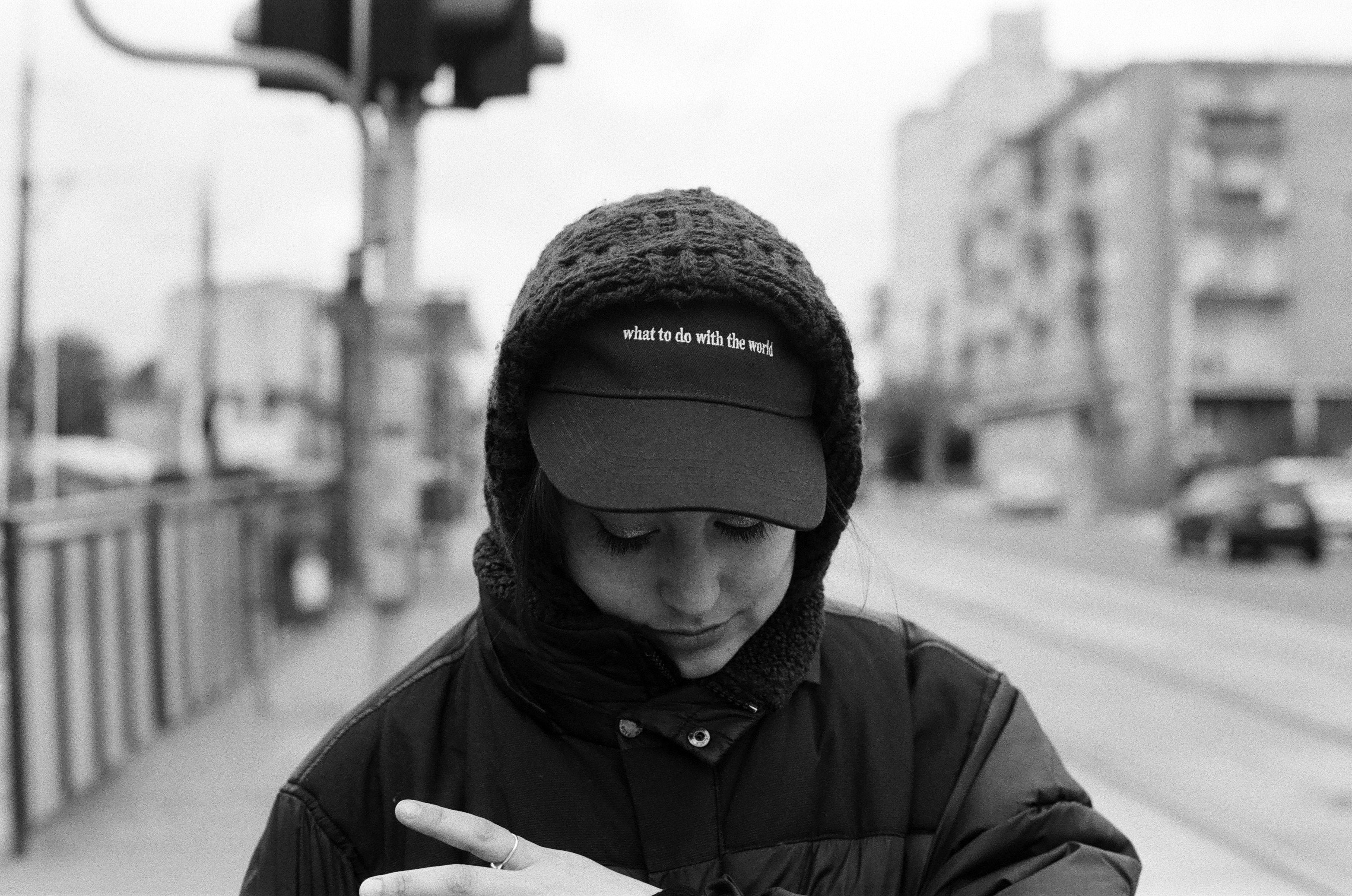 girl in cap captured on black and white film