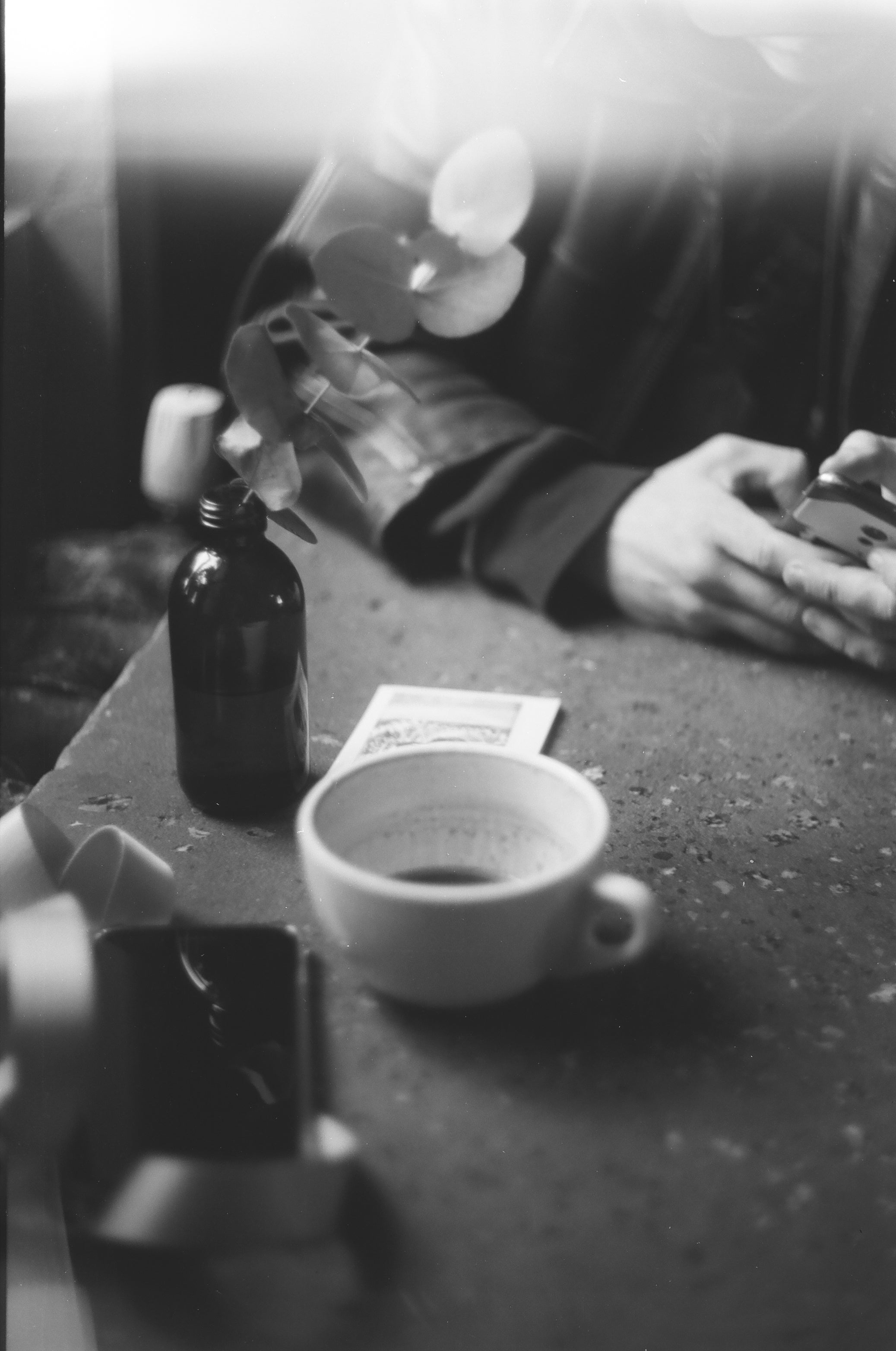 a cup on the table shot on black and white film