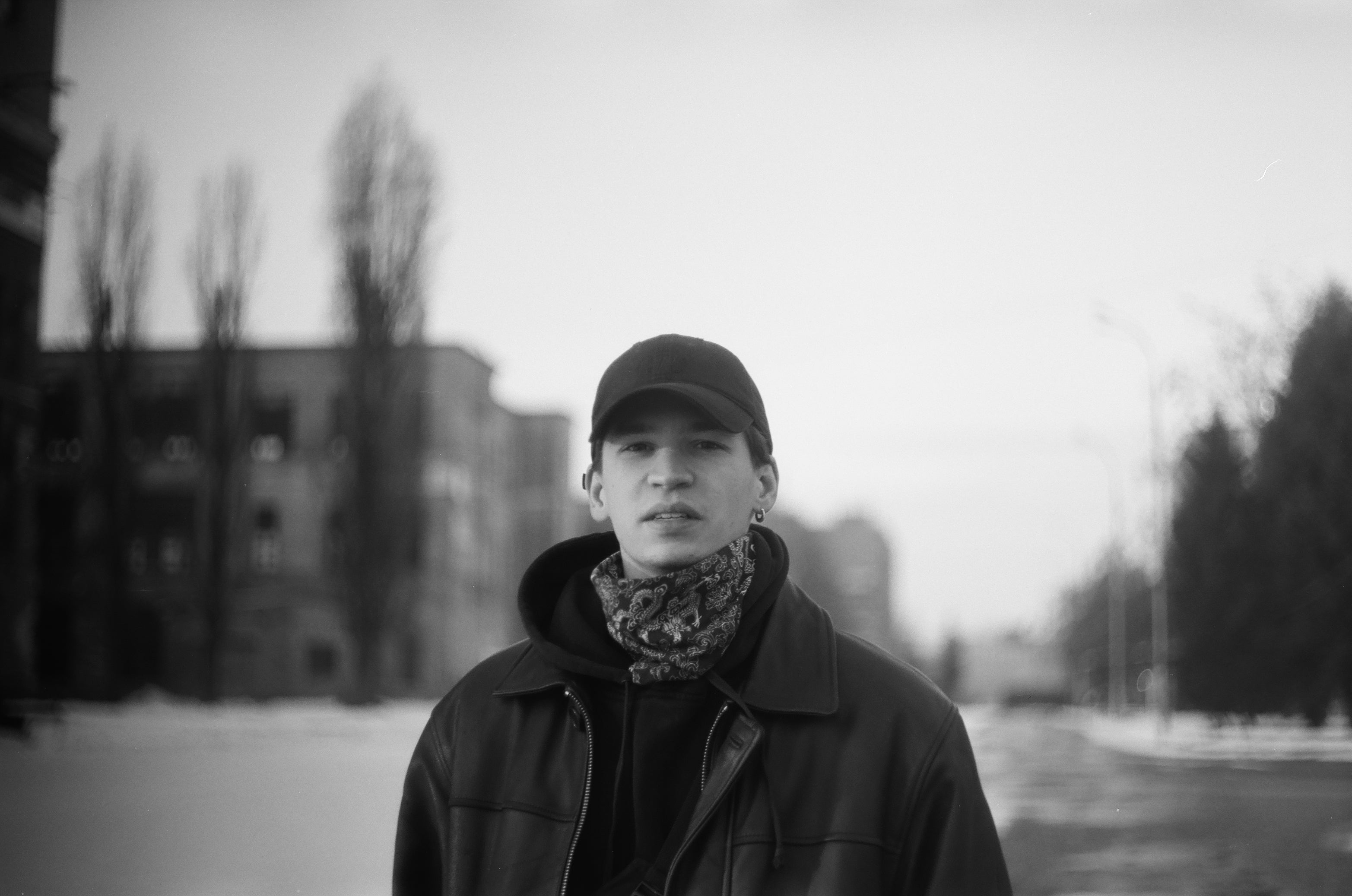 young man in the city captured on black and white film