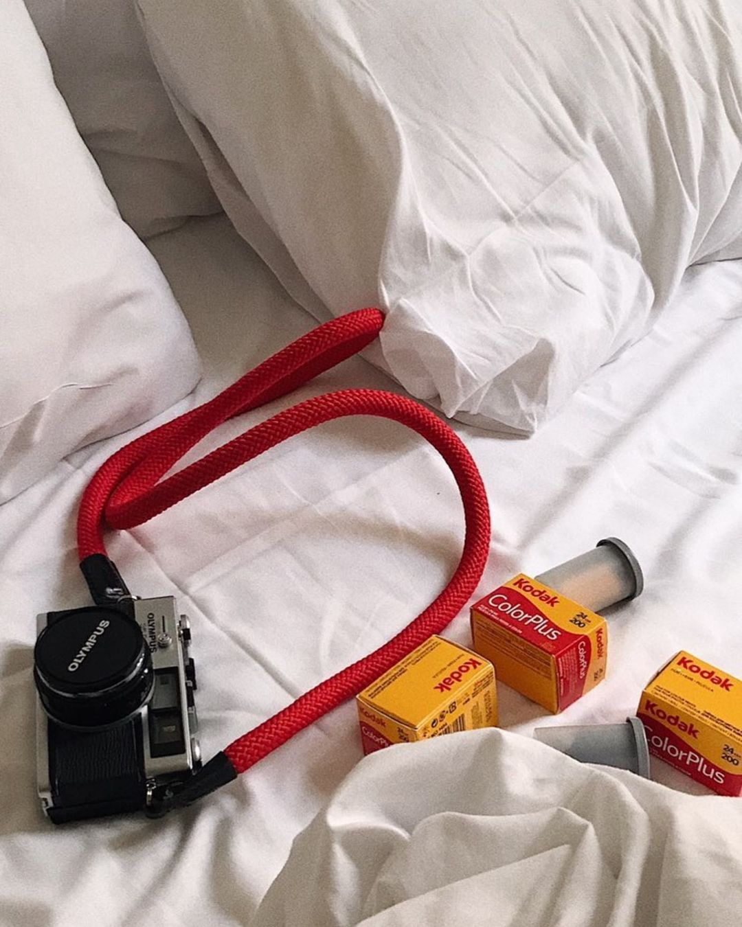 camera with red straps and films at Film Speed Lab