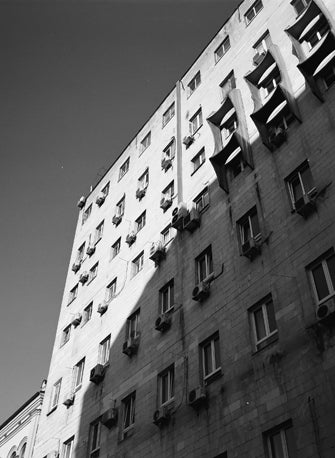 front of building in sunlights shot on Kodak Tmax 400 b&w film