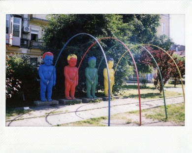 Fujifilm Instax film photo of a city sculptures