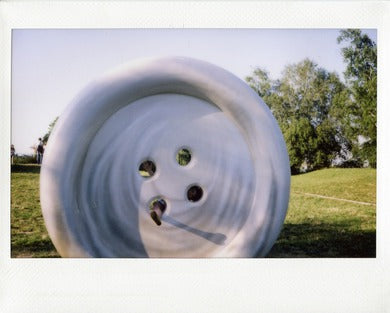 City sculpture captured on Fujifilm Instax film print