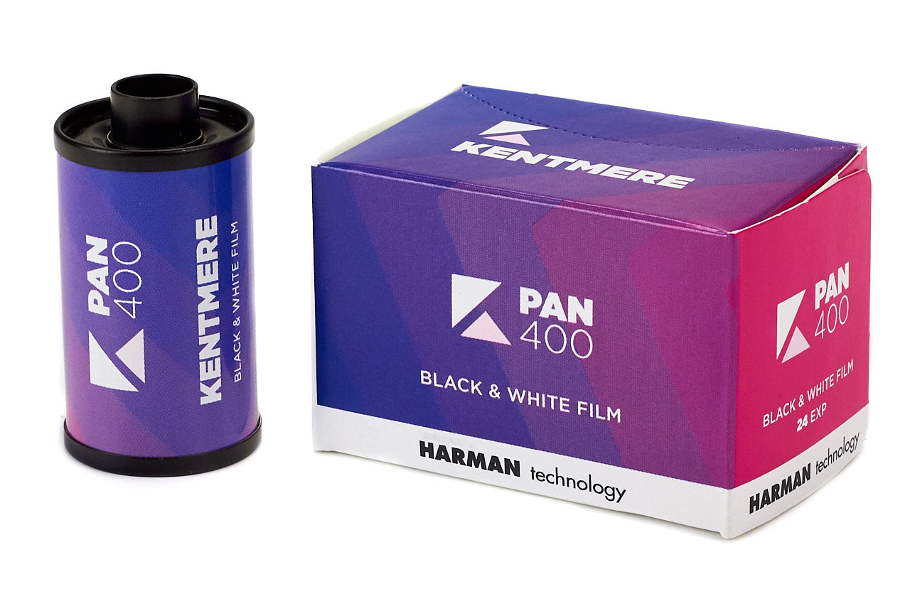 Kentmere Pan 400 black and white film canister and packaging on a white background