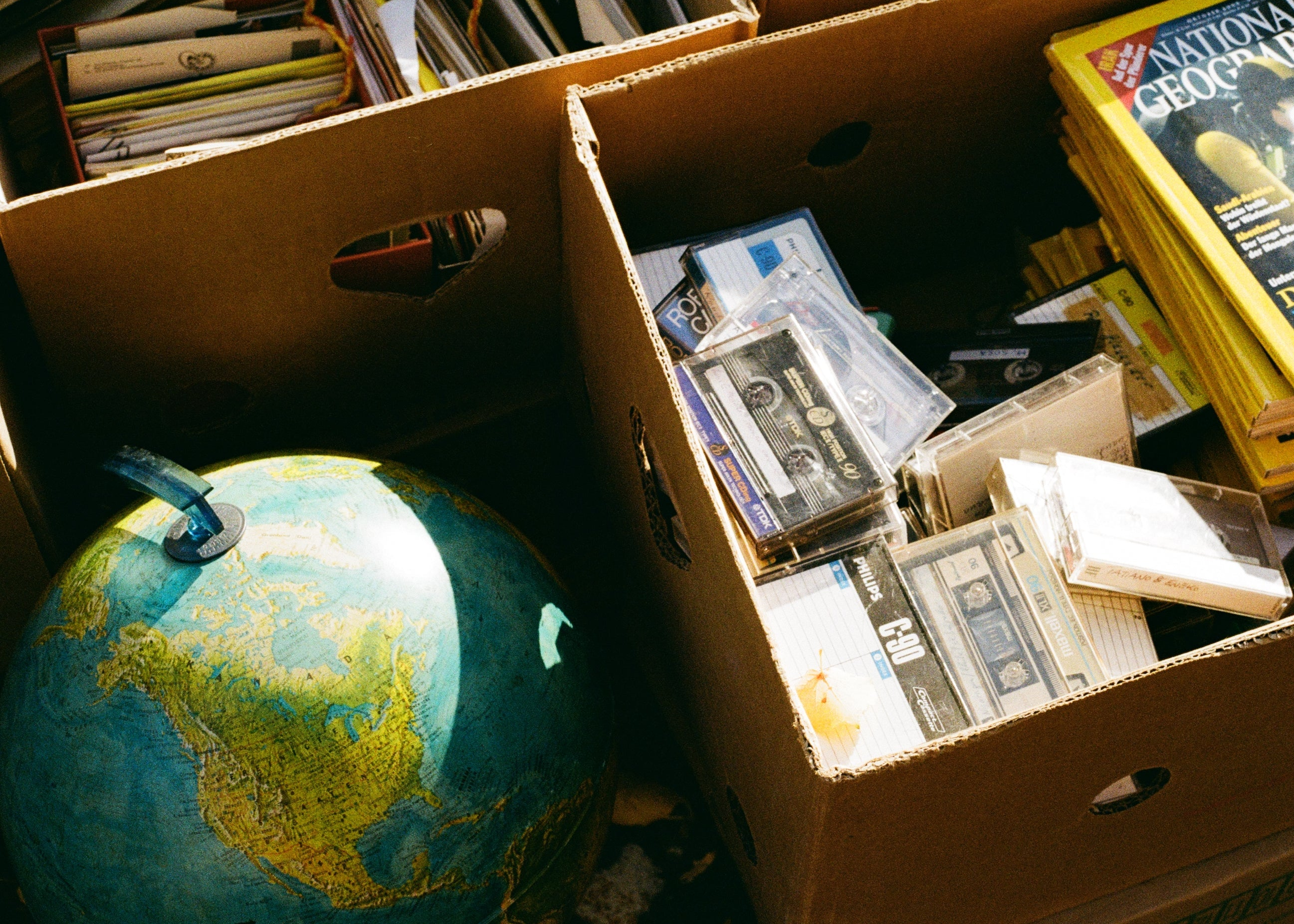 Globe and cassette boxes digitized with film scanning by Film Speed Lab